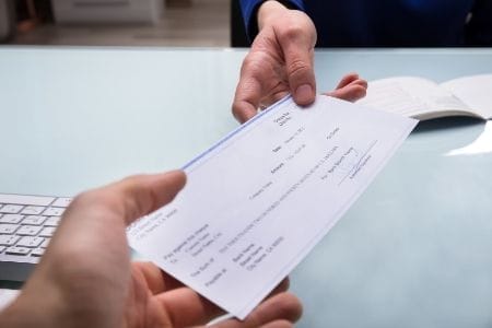 check-handed-over - CHAX check printing